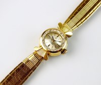 Lot 354 - A Lady's 18ct gold Omega bracelet wristwatch,...