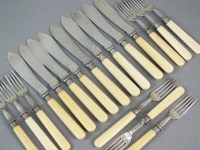 Lot 26 - A set of twenty four silver fish knives and...