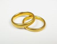 Lot 54 - Two plain polished 22ct gold wedding bands,...