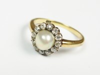 Lot 60 - A pearl and diamond cluster ring, designed as...