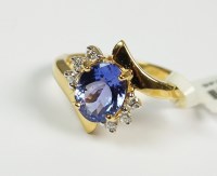 Lot 77 - An 18ct yellow gold tanzanite and diamond...