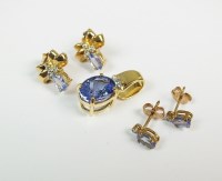 Lot 87 - An 18ct gold tanzanite and diamond pendant...