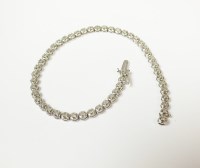 Lot 137 - A 9ct white gold diamond tennis bracelet,...