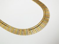 Lot 144 - An 18ct tri-coloured gold fringe necklace,...