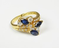 Lot 146 - A sapphire and diamond cluster ring, designed...