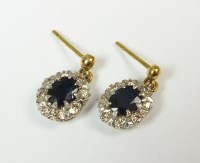 Lot 151 - A pair of sapphire and diamond oval cluster...