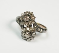 Lot 162 - A diamond floral cluster ring, designed as two...