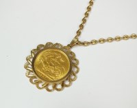 Lot 169 - An Elizabeth II sovereign, within 9ct gold...