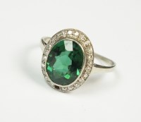 Lot 175 - A green stone and diamond oval cluster ring,...