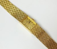 Lot 186 - A Lady's 18ct yellow gold Omega bracelet watch,...