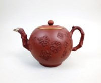 Lot 250 - A Staffordshire redware teapot and associated...