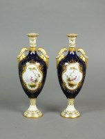 Lot 265 - A pair of Coalport cobalt and gilt two handled...