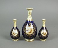 Lot 281 - A garniture of three Coalport porcelain cobalt...