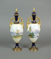 Lot 283 - A pair of Coalport porcelain two handled...