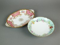 Lot 288 - A Coalport porcelain pink batwing two handled...