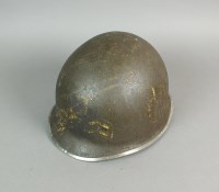 Lot 416 - A US M1 pattern helmet, the shell with fixed...