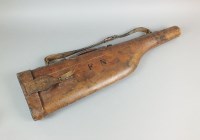 Lot 417 - A leather leg o' mutton gun case with carrying...