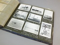 Lot 430 - An album containing a collection of war time...