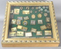 Lot 529 - A glazed case containing numerous dolls house...