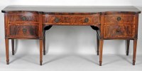Lot 548 - A George III mahogany serpentine sideboard the...