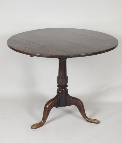 Lot 564 - A George III oak tripod table, late 18th...