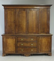 Lot 584 - A George IV oak housekeepers cupboard, second...