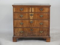 Lot 606 - A walnut crossbanded chest of drawers, early...