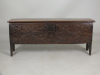 Lot 612 - A carved oak six plank chest, 16th / 17th...
