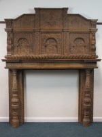 Lot 631 - A large and ornate carved oak chimney piece,...
