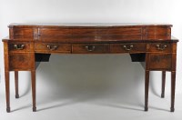 Lot 90 - A Geroge III mahogany serpentine sideboard, of...