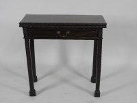 Lot 100 - A George III mahogany fold over tea table of...