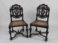 Lot 144 - A matched set of six carved walnut low back...