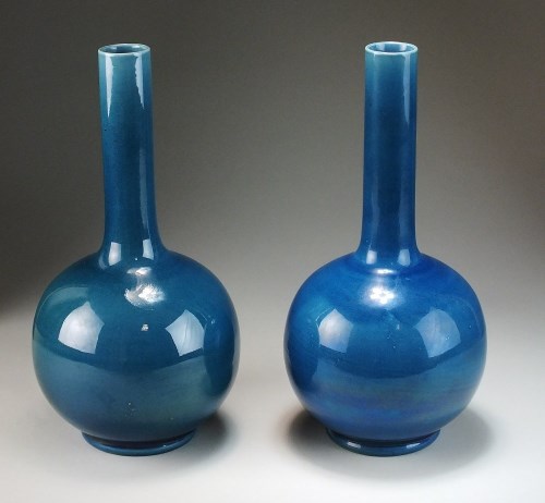 Lot 199 - A pair of Burmantofts pottery blue ground...