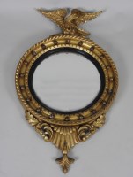 Lot 244 - A 19th century giltwood and gesso convex wall...