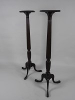 Lot 253 - A pair of mahogany bedpost torcheres with...