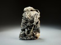Lot 22 - A grey and black jade carving of five dragons,...
