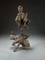 Lot 57 - A Chinese carved rootwood figure of a Li...