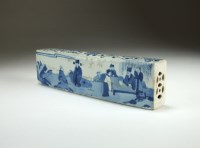 Lot 101 - A Chinese blue and white scroll weight, 19th...