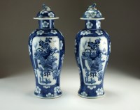 Lot 103 - A pair of Chinese blue and white vases and...
