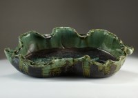 Lot 145 - A Chinese glazed brown stoneware centrepiece,...