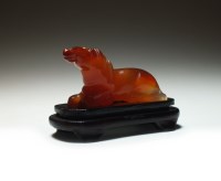 Lot 164 - A Chinese carved carnelian figure of a horse,...