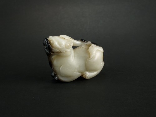 Lot 165 - A grey and black nephrite jade figure of a...