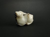 Lot 165 - A grey and black nephrite jade figure of a...