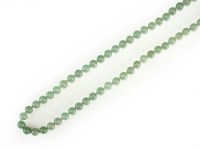 Lot 166 - A pale green jadeite bead necklace, the...