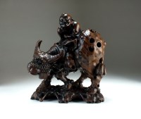 Lot 206 - A Chinese carved rootwood figure of a boy on a...
