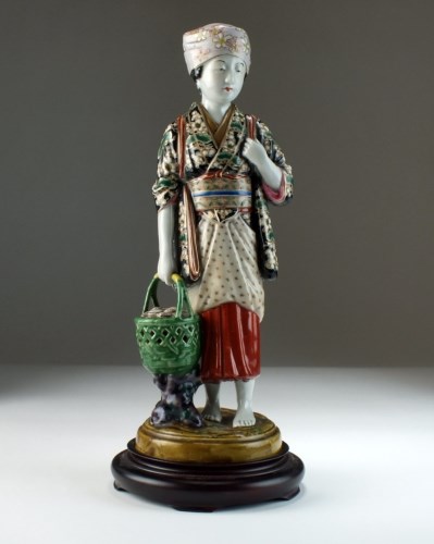 Lot 246 - A Japanese Kutani figure of a maiden,...