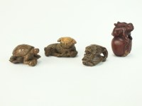 Lot 261 - Four Japanese carved wood netsuke, 19th/early...