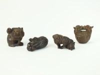 Lot 262 - Four Japanese wood netsuke, 19th/early 20th...