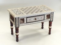 Lot 283 - An Islamic inlaid wood games table, of...