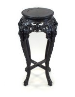 Lot 285 - A Chinese zitan hardwood urn stand, 19th...